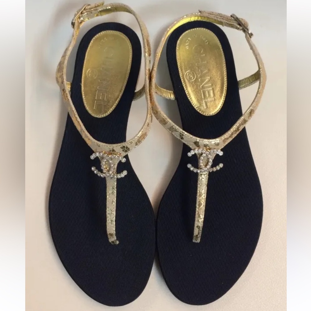 CHANEL Gold T-Strap Sandals with Black Footbed and Crystal CC